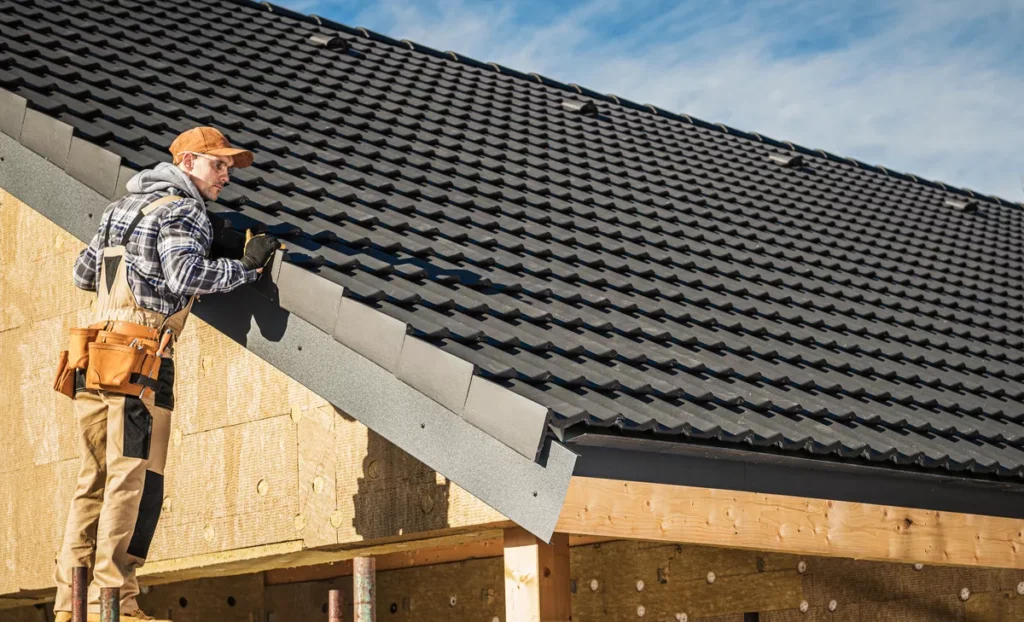 A licensed roofing contractor on scaffolding performing a detailed tile roof inspection and checking for material wear on a Scottsdale home.
