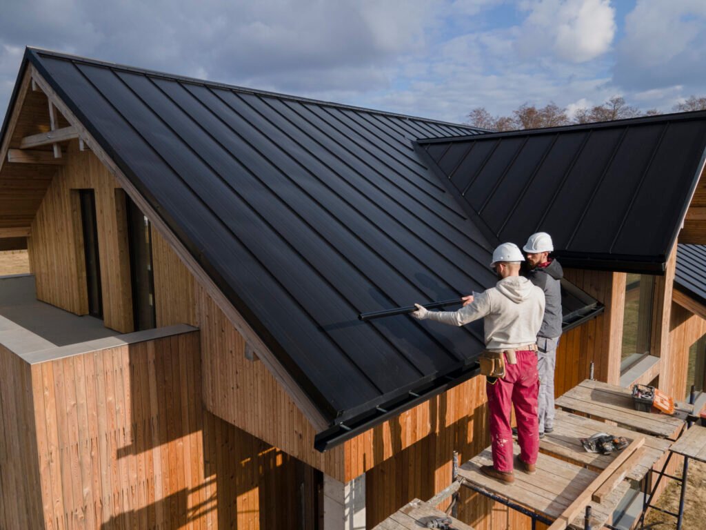 full shot roofers working together with helmets scaled 1.jpg